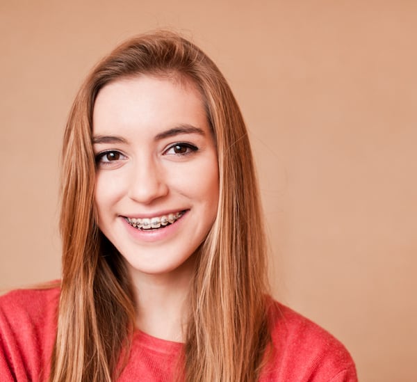 smiling teen with braces in Bee Cave Texas